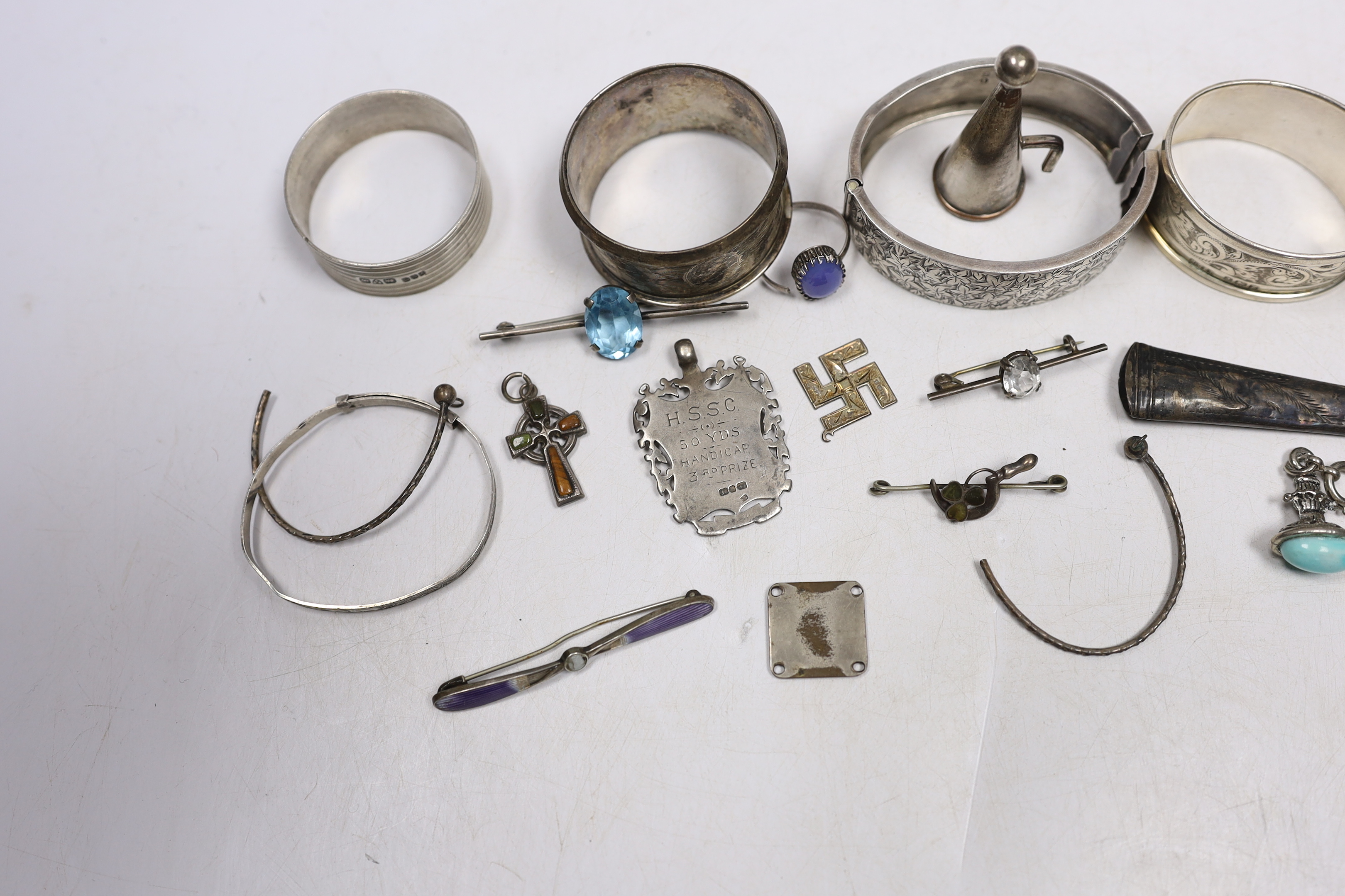 Small silver and other items including napkin rings, bracelets, 19th century vinaigrette, medals, etc.